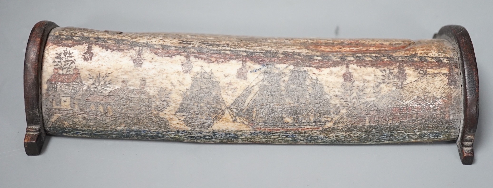 An 18th/early 19th century scrimshaw whale bone carving, 19cm